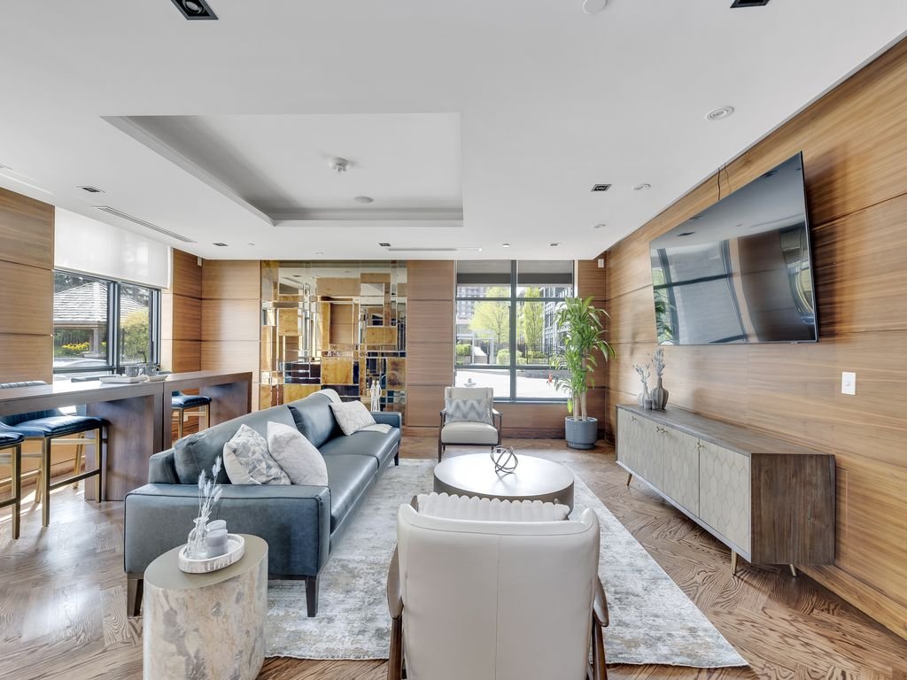 Lounge at 21 Clairtrell showing the TV wall, sideboard and sofa seating