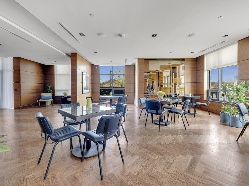 Tables and chairs across the open party room at 21 Clairtrell