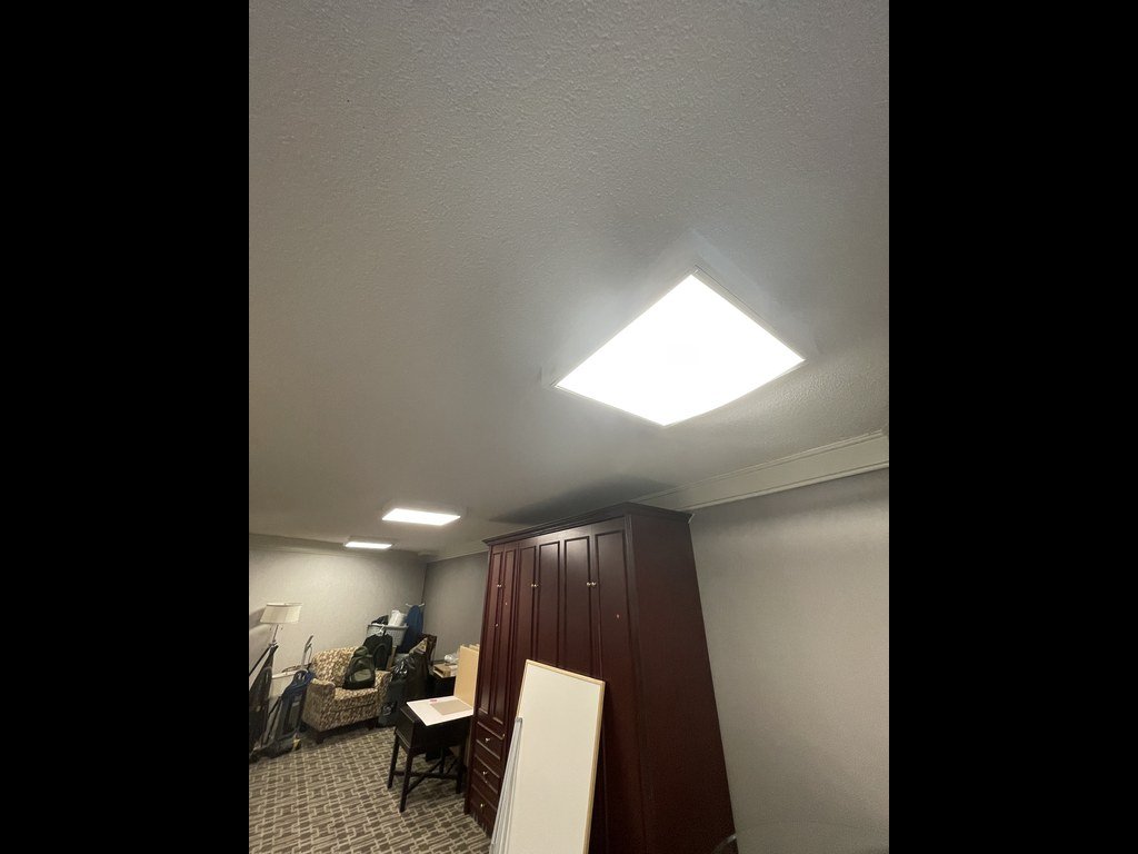 Dark wardrobe and storage in the 250 Queens Quay party room before renovation